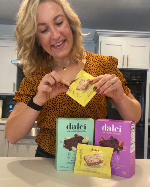 Whitney Stuart holding Dalci Snack Bars