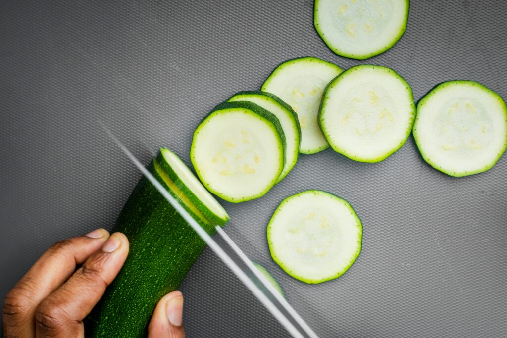 person slicing cucumber - fat and fiber 